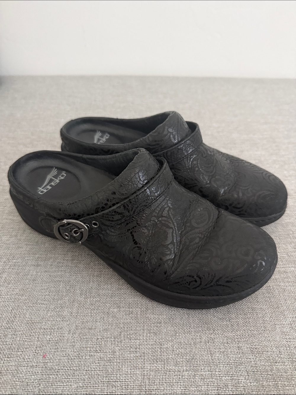 Dansko Allison Black Embossed Leather Clogs with Buckle Accent